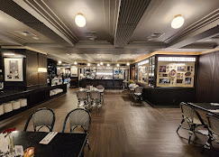 Lune restaurant elegant dining hall with monochromatic interior